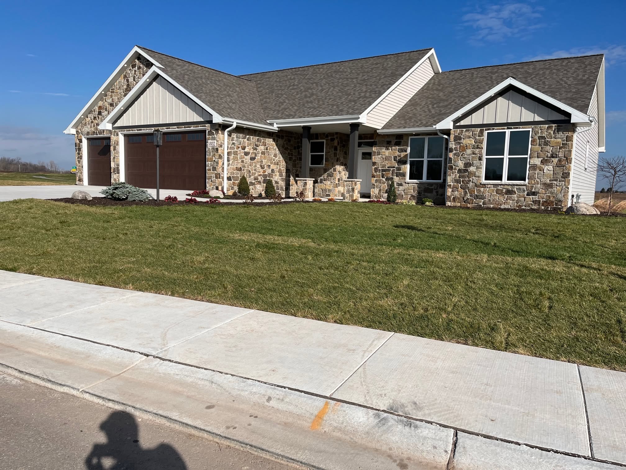 Completed custom home with stone exterior details